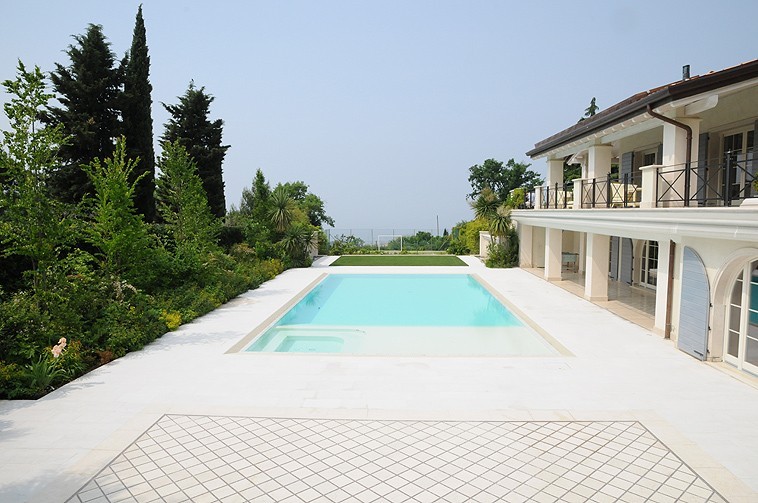 Clean lines covered with light coloured stone - Swimming Pools